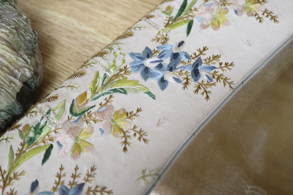 An easel dressing table mirror, the frame made from an 18th century waistcoat, with bevelled edge, overall length 73cm